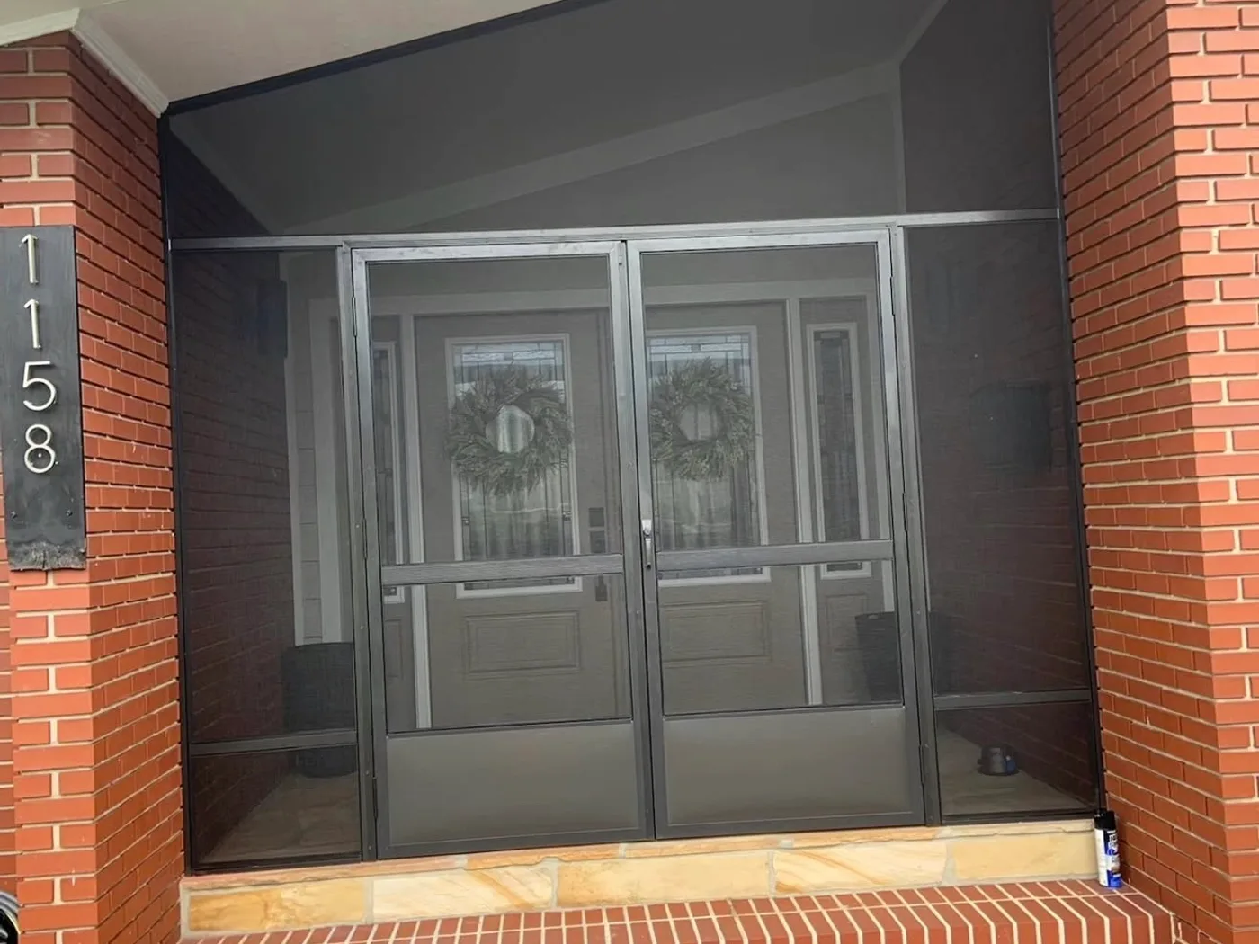 The same brick front entry closed in with a screen enclosure, Northeast Florida