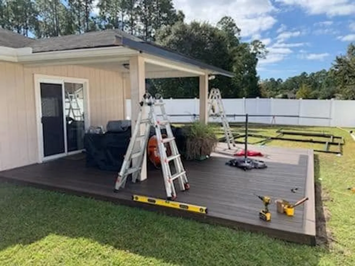 Bare wood deck with ladders and tools before a screen enclosure was built, Greater Jacksonville FL